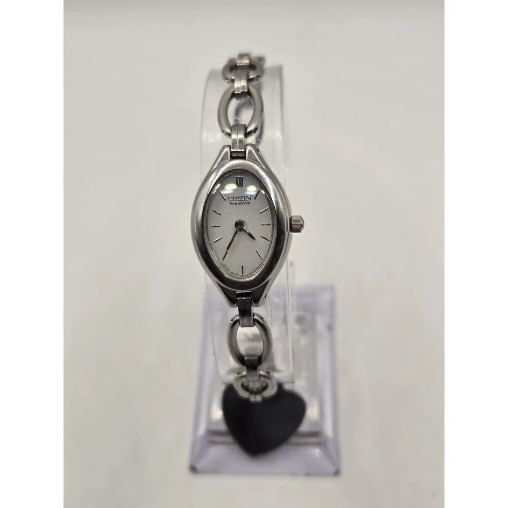 Citizen Eco-Drive Oval Silver Tone White Dial Heart Charm Bracelet Watch.